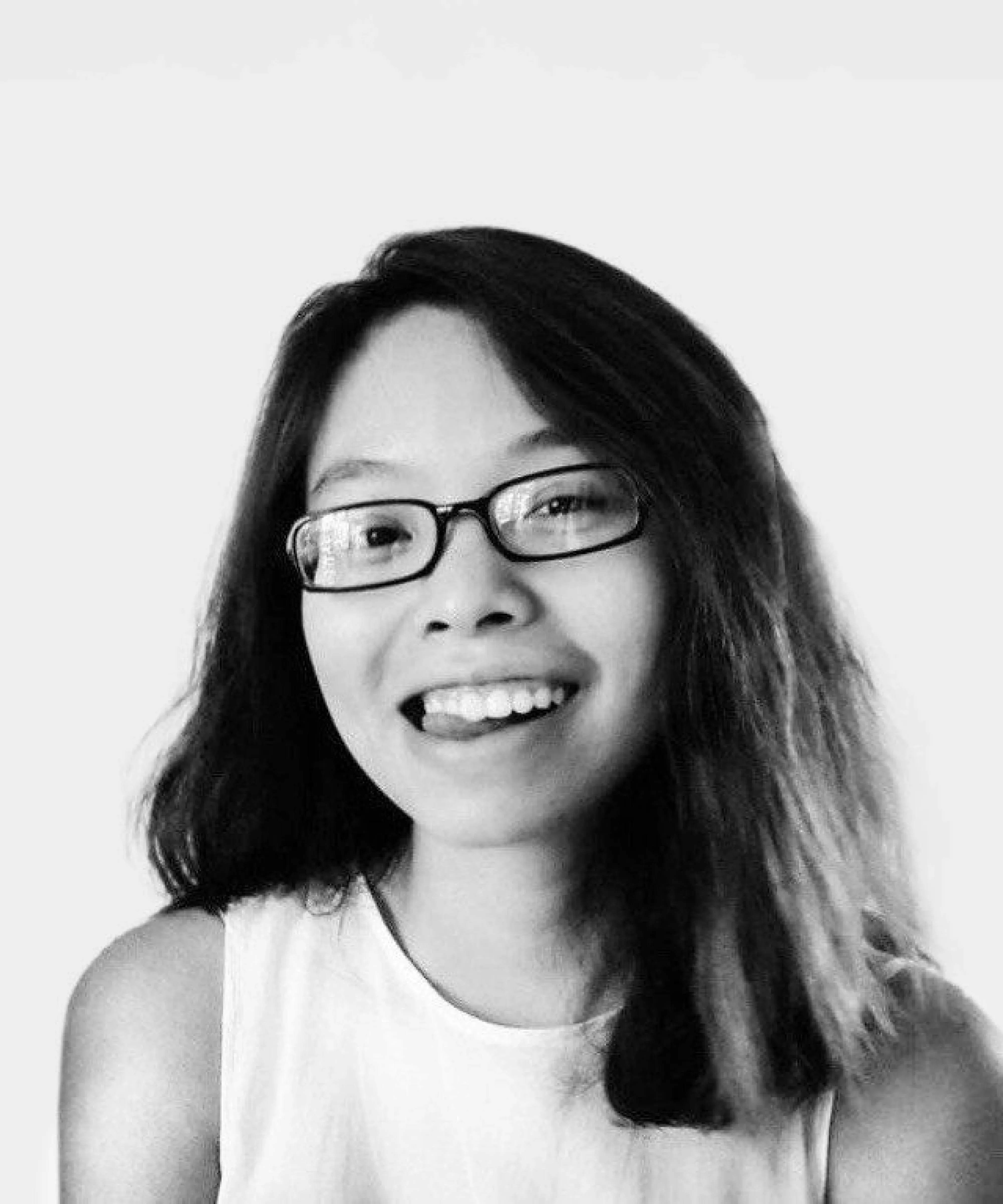 Profile portrait of a man in a white shirt against a light background